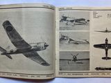 an open book with a picture of a plane in it