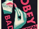 an old poster of a woman putting lipstick on her lips