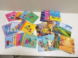 a lot of children ' s books on the table