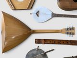 many different types of musical instruments displayed on a white surface