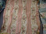 an image of a bed with a blanket and a pillow on top of it