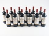 a group of six bottles of wine sitting next to each other