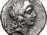 a silver coin with a head of a woman on it