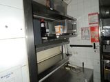 an image of a commercial kitchen with stainless steel appliances