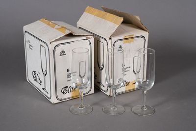 two empty wine glasses sitting next to each other