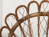 a wicker basket with a bunch of branches in it