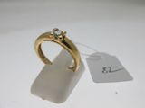 an image of a gold ring with a diamond on top of it