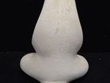 a white object that is sitting on a black surface