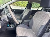 the interior of a car with two seats and a steering wheel