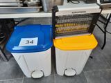 two trash cans sitting next to each other on the floor