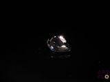 an image of a close up of a ring in the dark