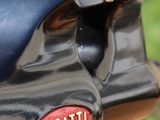 a close up of a bugatti logo on a motorcycle
