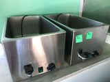 two stainless steel sinks sitting on a counter in a kitchen