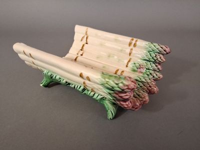 a small bench made out of bamboo sticks on a table