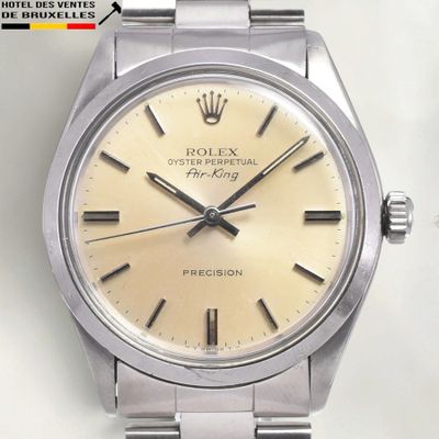 an image of a rolex watch with a yellow dial