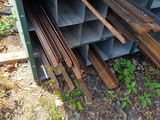 a pile of steel bars stacked on top of each other