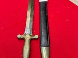 two knives are sitting on a red cloth on a table