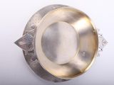 an image of a silver plate sitting on top of a white table