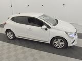 a picture of a small white car parked in a garage
