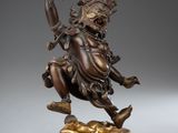 a bronze statue of a man riding on a horse