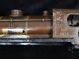 a toy train that is sitting on a black surface