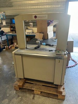 a machine that is sitting on a pallet in a warehouse