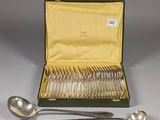 a box of silverware with a spoon and spoons in it