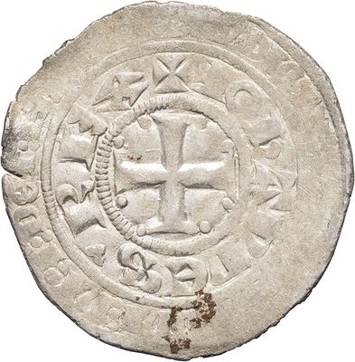 a close up of a coin with a cross on it