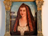 tableau représentant une femme portant un voile, encadré et accroché au mur