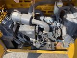 a close up of a small engine in a yellow box