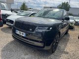 black range rover parked in a lot with other cars in the background