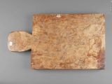 an image of a piece of wood with a piece of paper on it