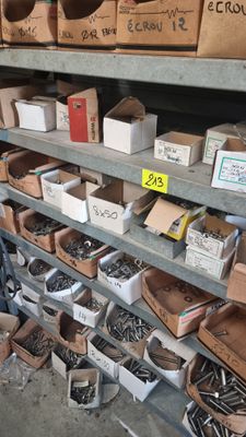many boxes of screws and nuts on the shelves