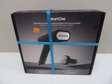packaging for a hair dryer with a blue ribbon wrapped around it