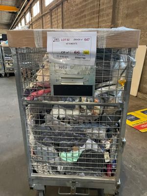 a cart with a lot of items in it in a warehouse