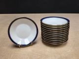 six blue and white plates stacked on top of each other on a table
