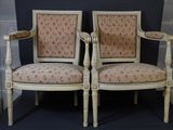 pair of antique chairs with floral upholstered upholstered cushions