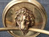 a lion head on the handle of a doorknob