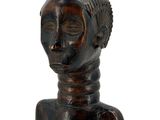 an image of a wooden statue of a woman with a headdress