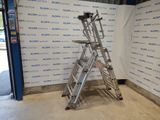 a ladder that is sitting in front of a wall