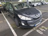 a black car that is parked in a parking lot