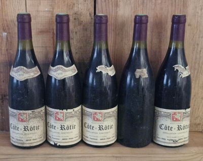 six bottles of wine are lined up on a wooden shelf