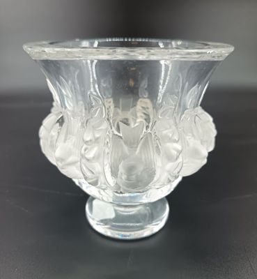 a clear glass vase sitting on top of a table