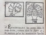 an old book with a drawing of a hand holding a bunch of money