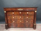 an antique chest of drawers with marble top