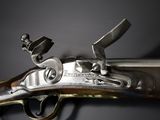 a close up of a gun that is on display
