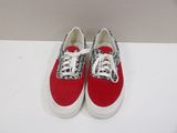 red and white sneakers with white laces on a white surface