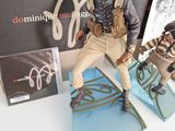 a figurine of a man on a snowboard on a table
