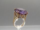 an image of a ring with a large amethorate stone in it