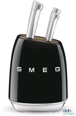 a black toaster with two knives in it